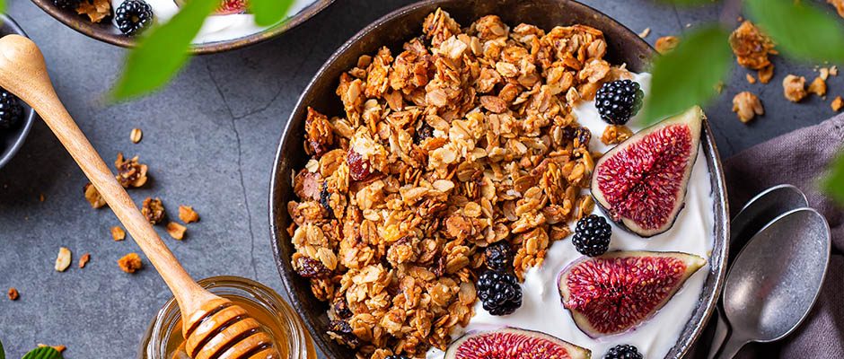 Homemade oat granola muesli with yogurt and berries for breakfast