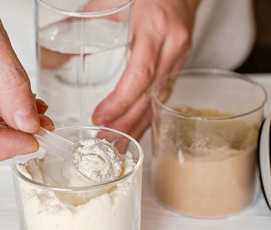 making Whey Protein drink in a glass